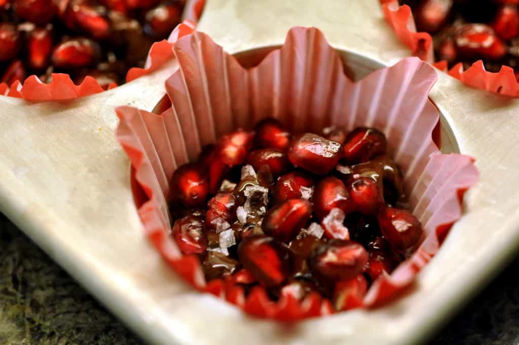 pomegranate dark chocolate bites in a cupcake liner