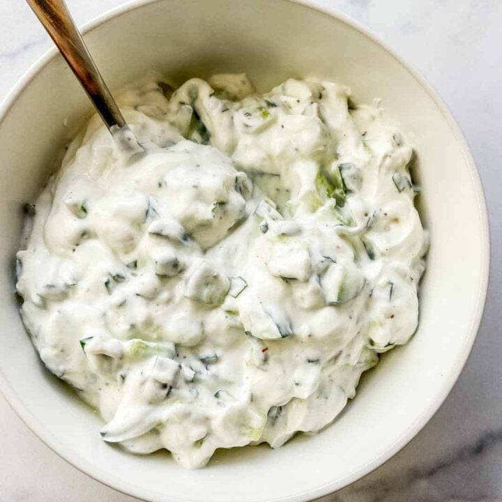 A bowl of yogurt cucumber sauce.