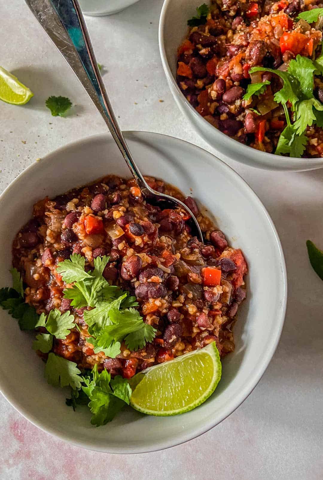 closeup of slow cooker black bean chili with a spoon