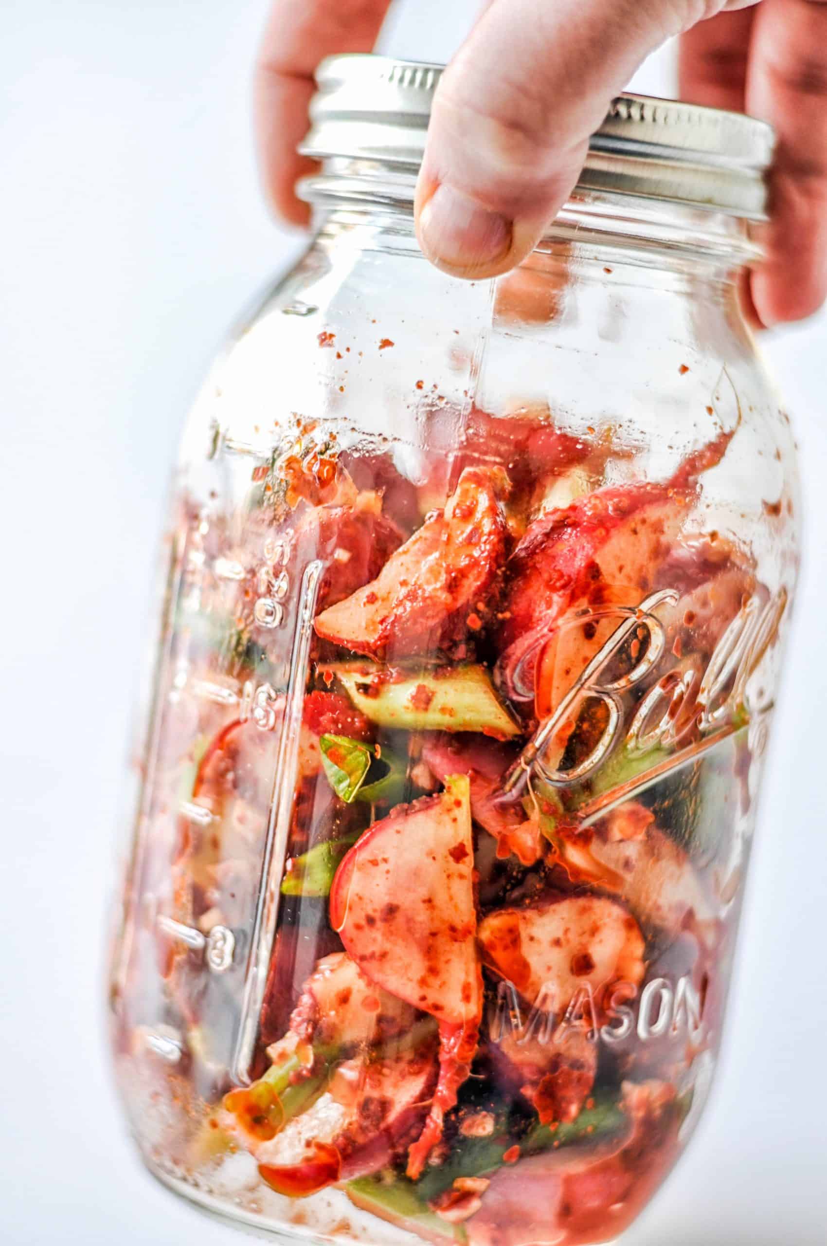 radish kimchi in a ball jar