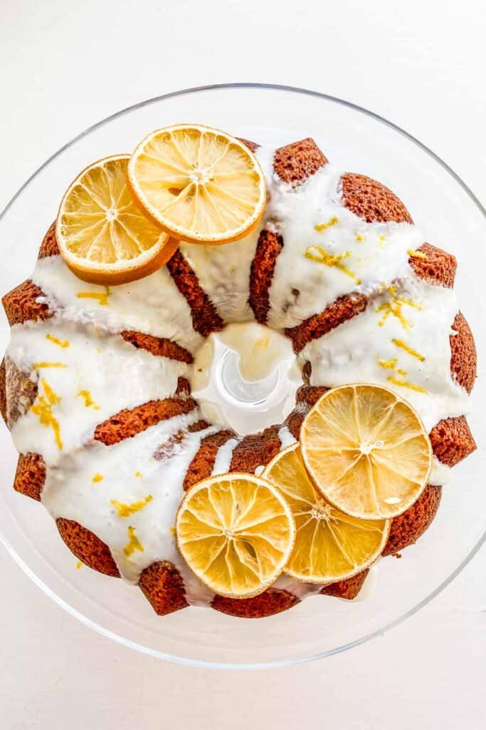 orange bundt cake on a glass plate