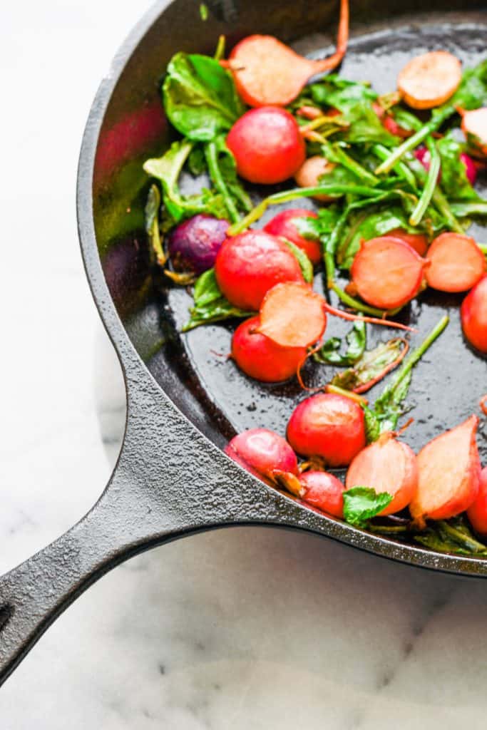 brown butter radishes in a cast iron skillet