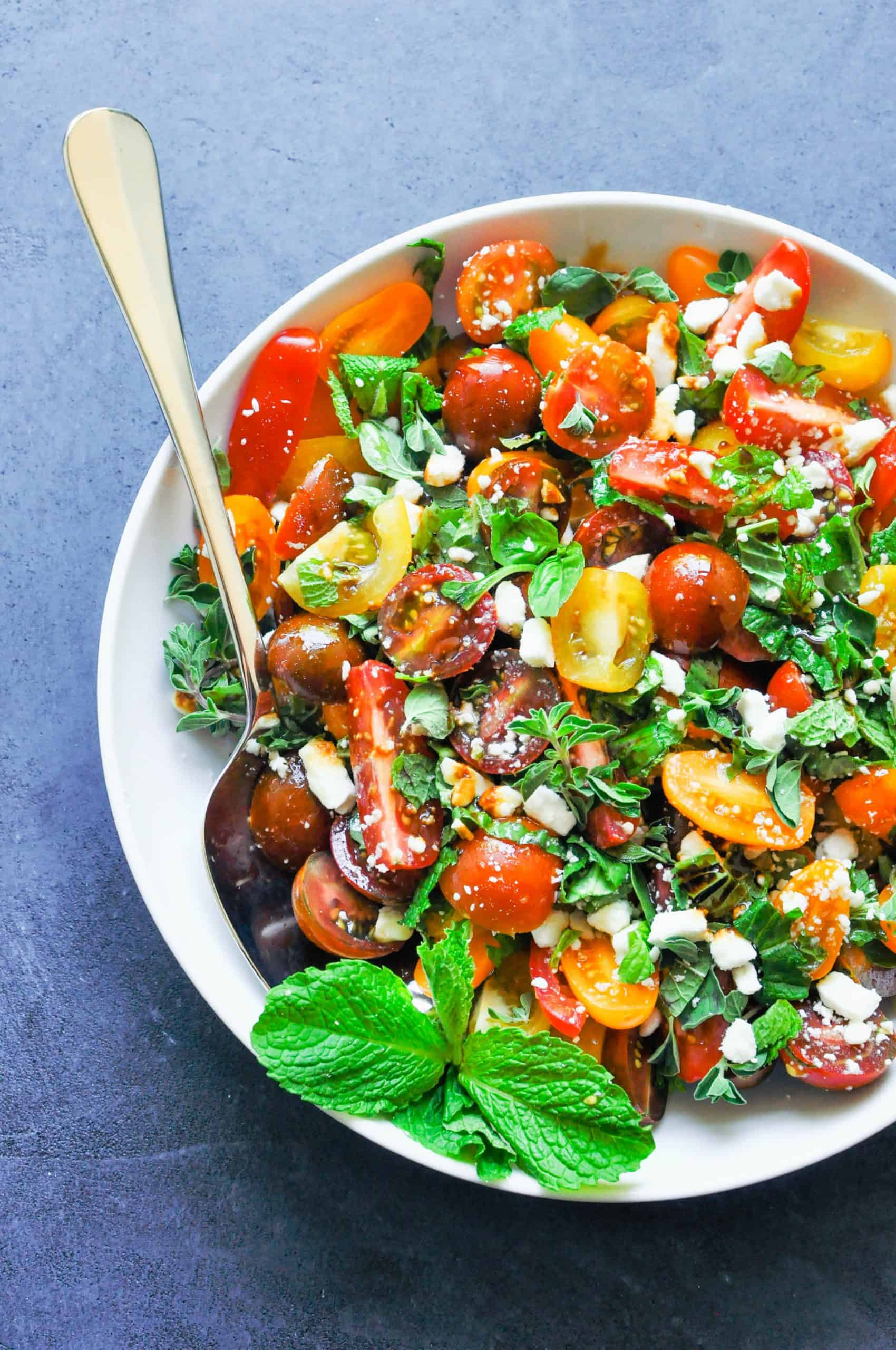 tomato and herb salad in a large serving bowl