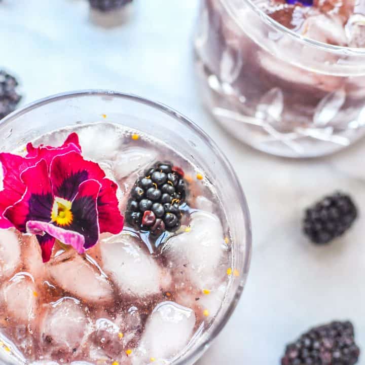 smash cocktail in a glass with blackberries
