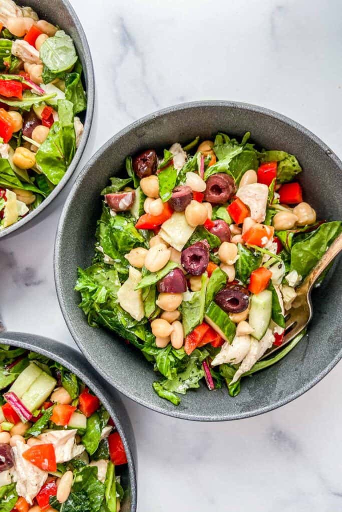 A closeup shot of a bowl of Mediterranean chicken salad.