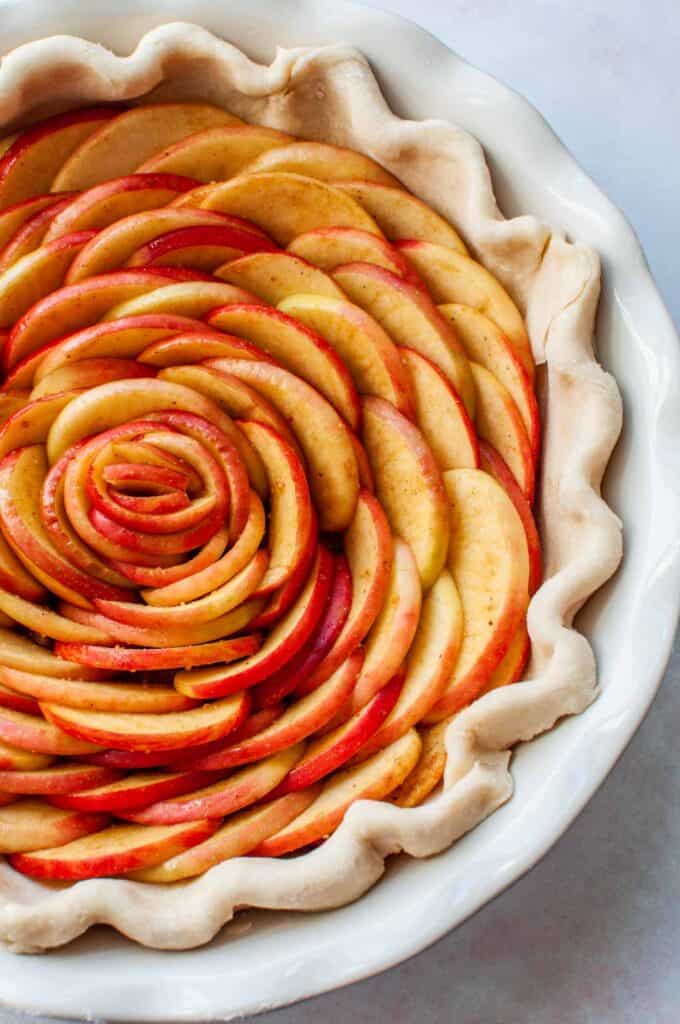 rose apple tart in a pie pan