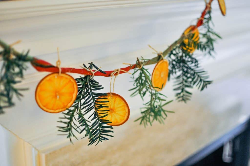 citrus garland hanging on mantle