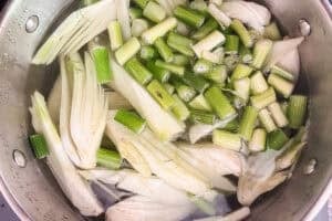 Fennel being boiled in a pot.
