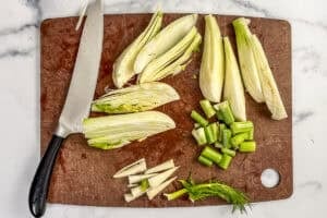 Sliced fennel on a cutting board.