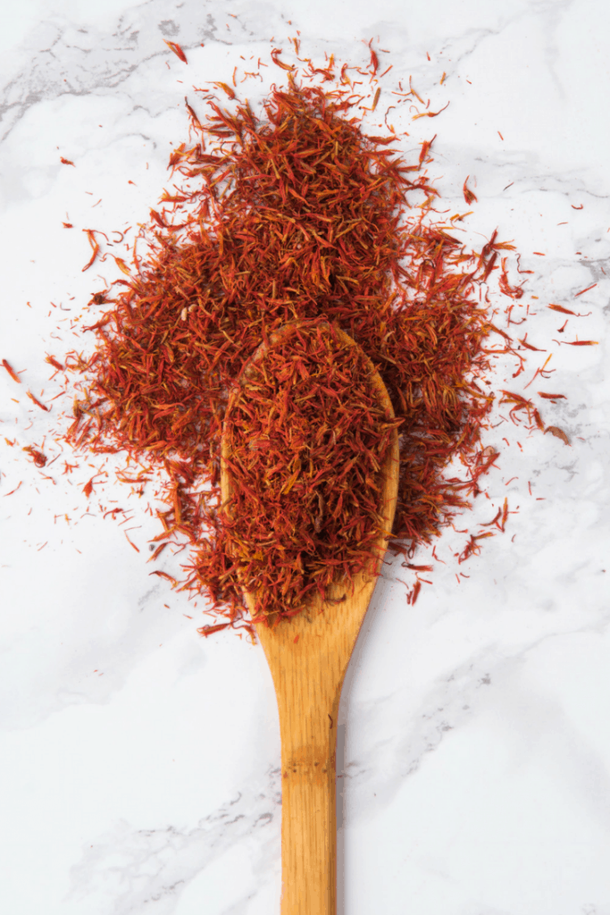 saffron strands on a wooden spoon