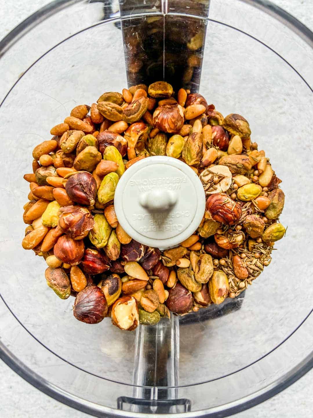 Ingredients for dukkah in a food processor.