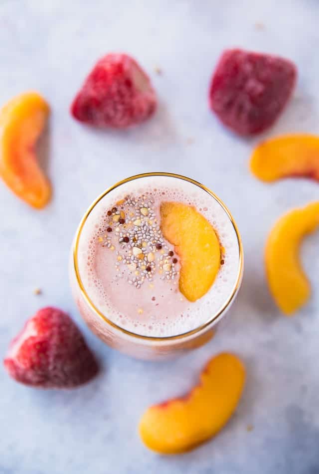 A strawberry peach protein smoothie from overhead.