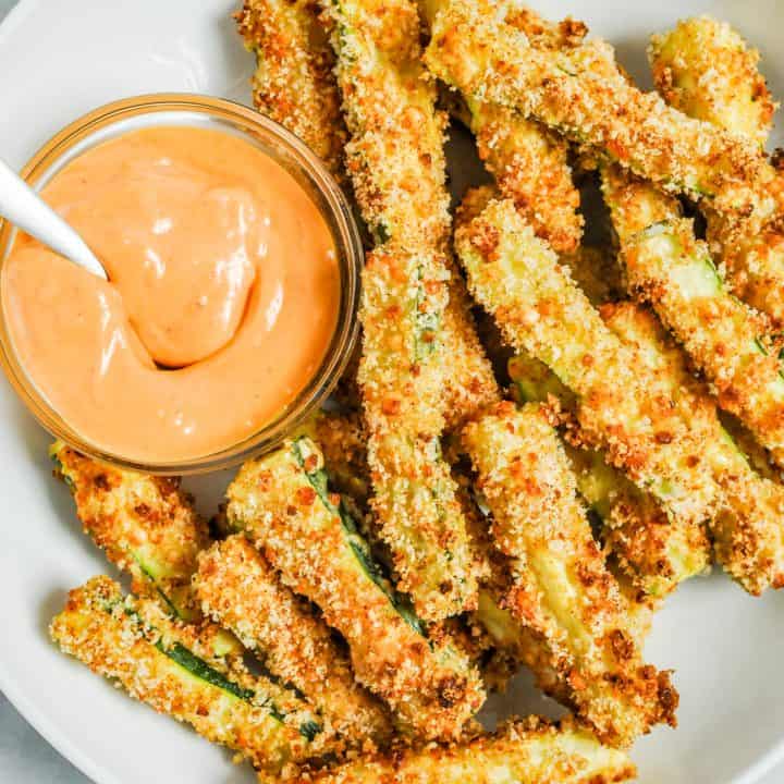 Baked zucchini fries with a dip.