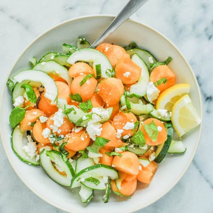 cantaloupe, cucumber, and cheese in a bowl