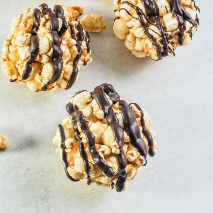 popcorn balls with chocolate drizzle