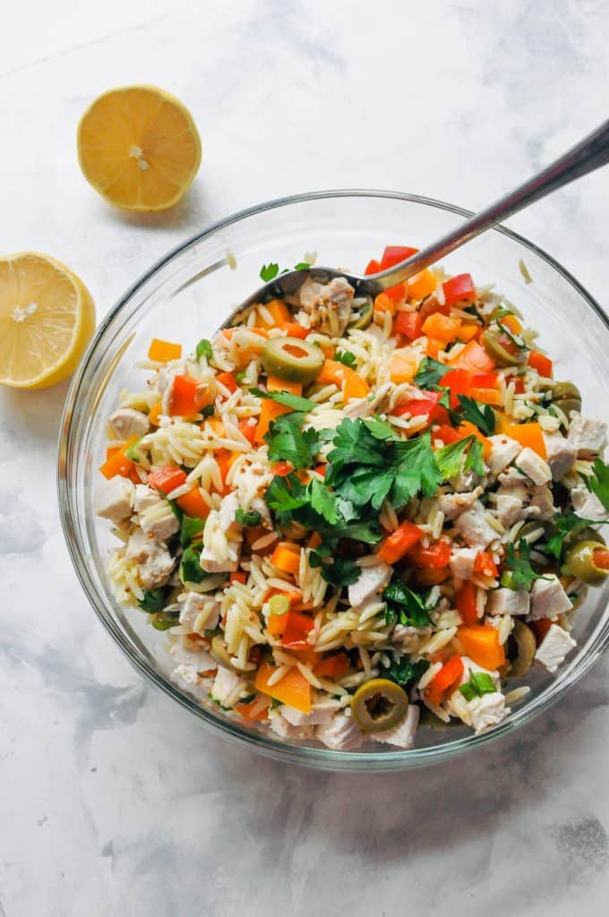 chicken orzo salad in a glass bowl