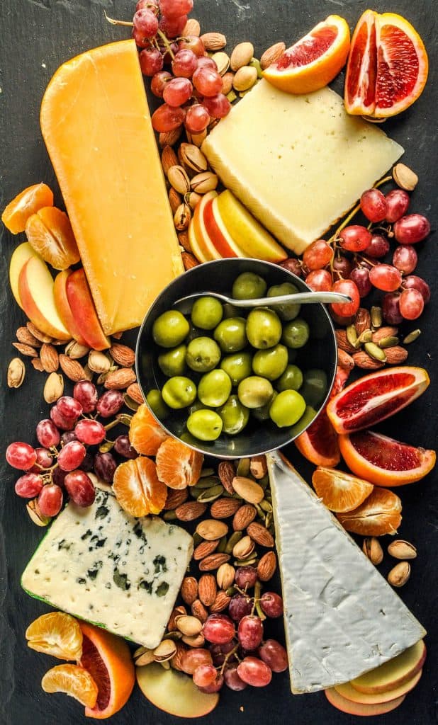 appetizer tray with cheese, nuts, and fruit