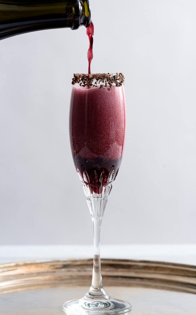 Sparkling shiraz cocktail in a tall glass.