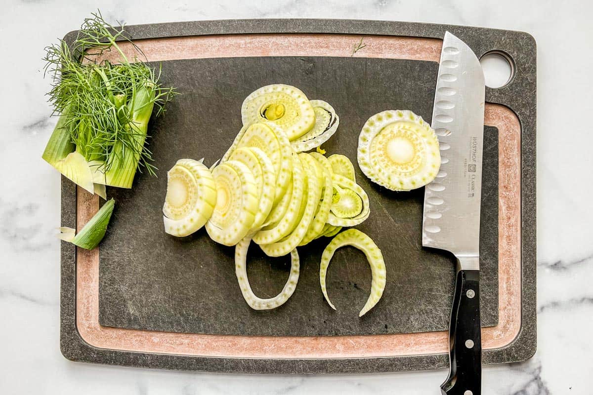 Sliced fennel on a cutting board.