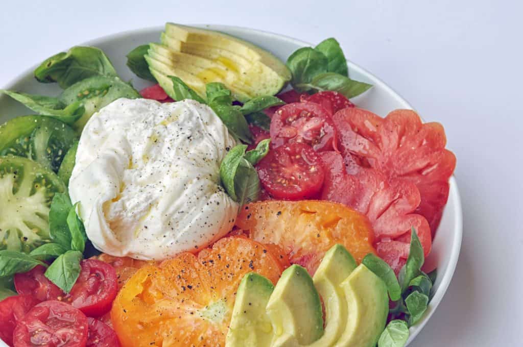 burrata caprese salad on a plate