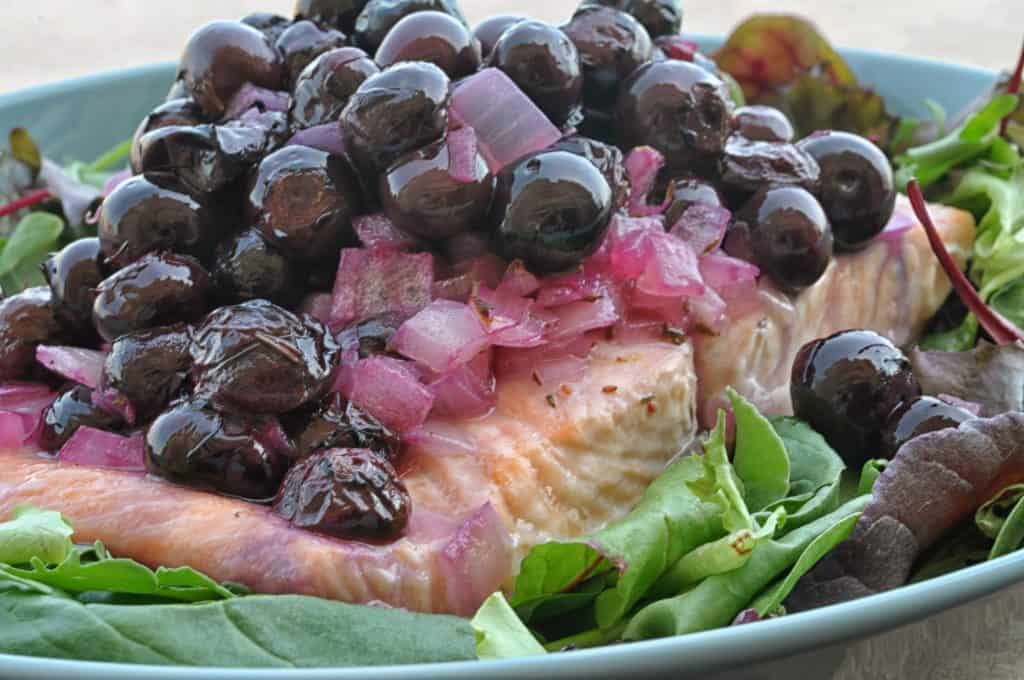 salmon with blueberries in a large bowl