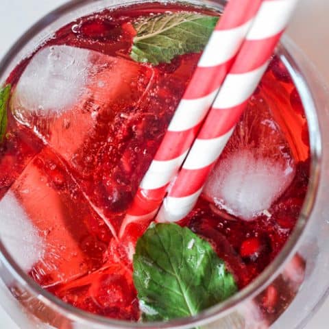 shirley temple in a glass with ice and straws