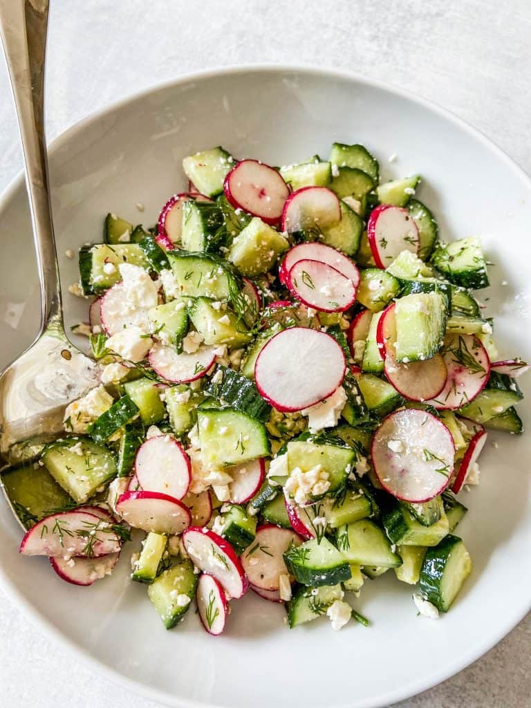 radish and cucumber salad in a bowl