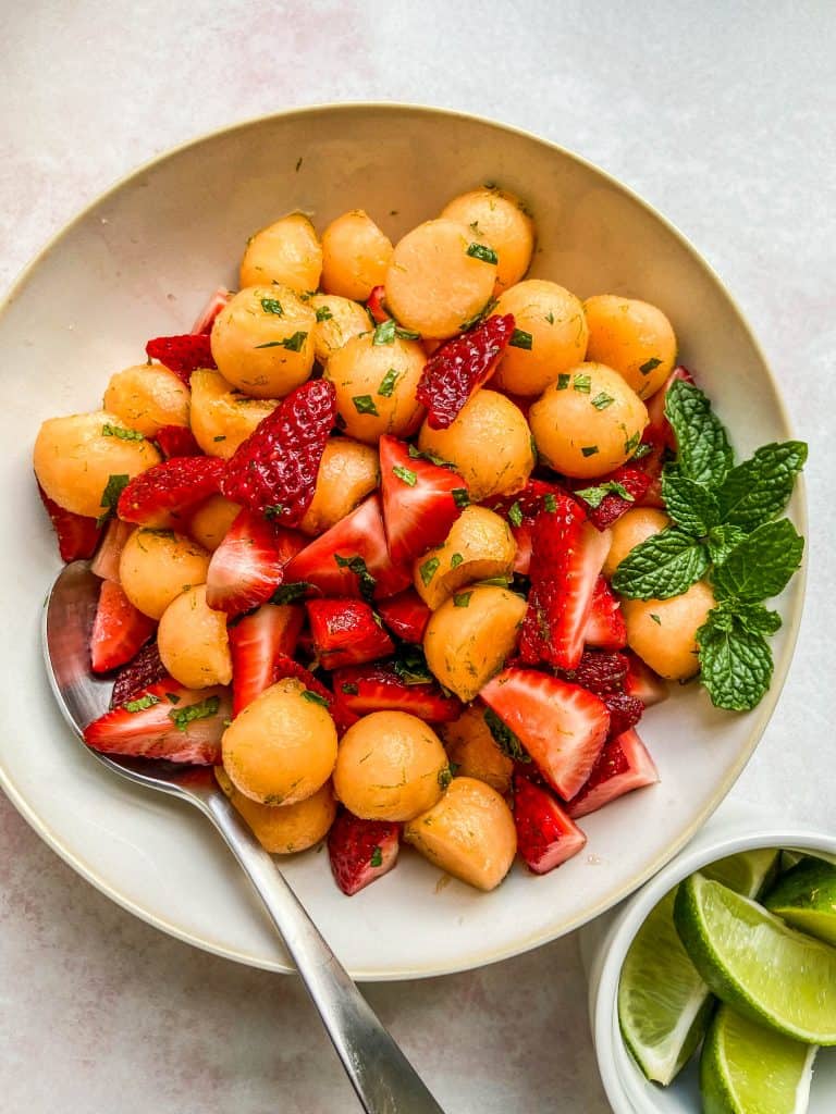 strawberry cantaloupe salad in a bowl