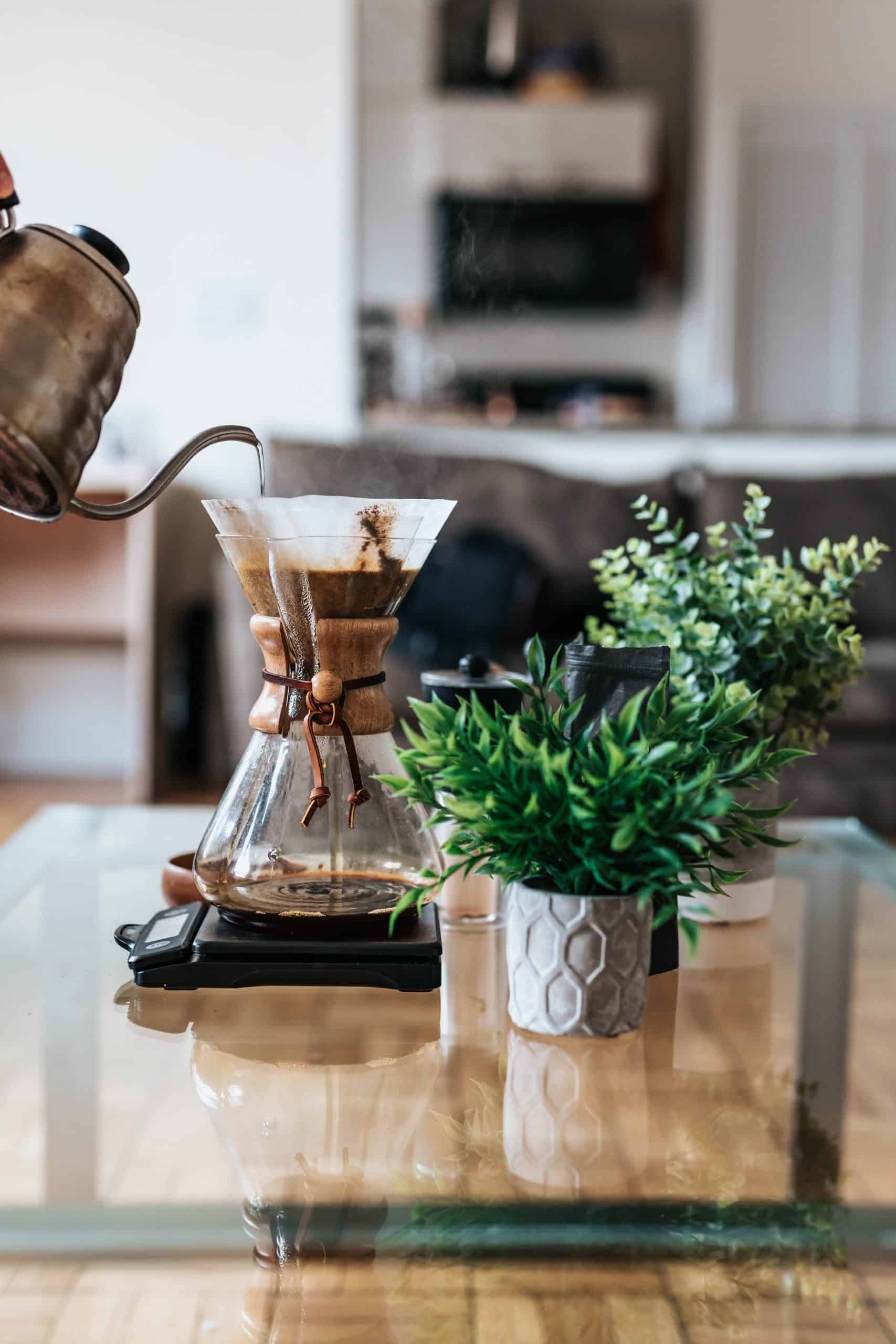 Coffee being poured through a carafe.
