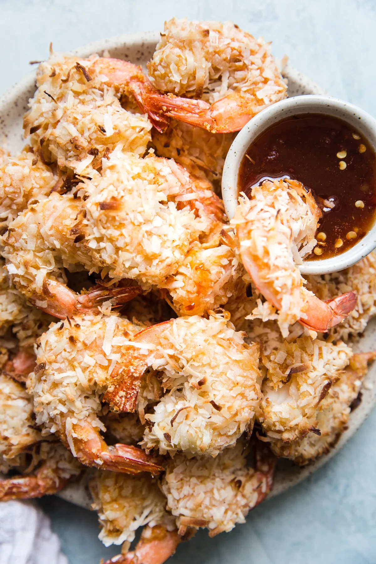 Baked coconut shrimp with dipping sauce.