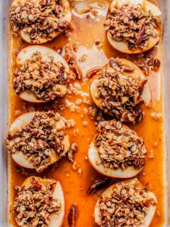 Baked apples with oatmeal in a large pan.