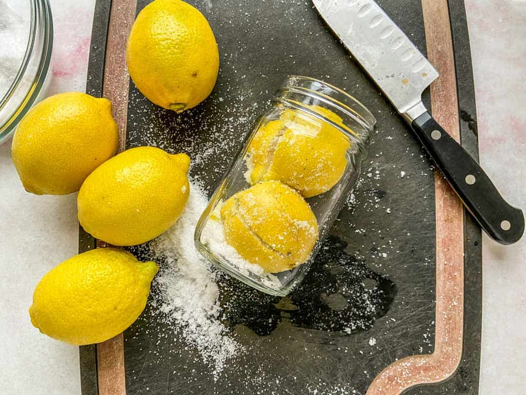Two lemons in a glass jar.