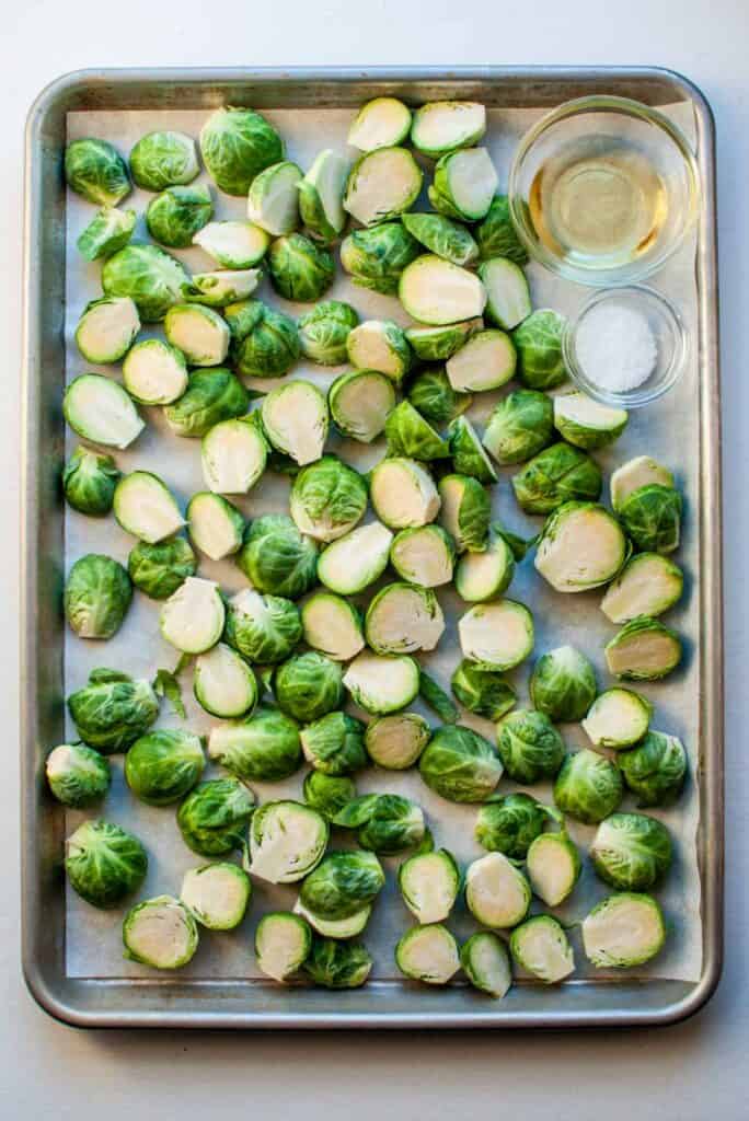 brussels sprouts, olive oil, and salt on a baking sheet