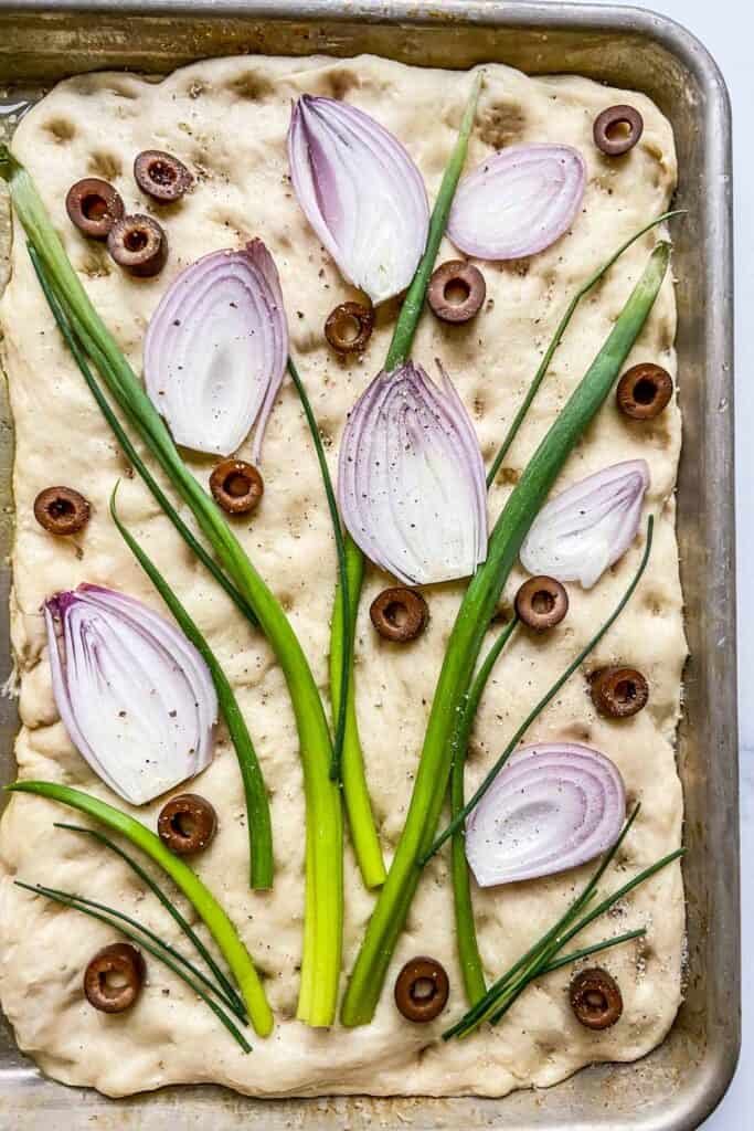 closeup of a decorated focaccia before baking
