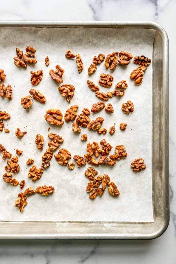 toasted walnuts on a baking sheet