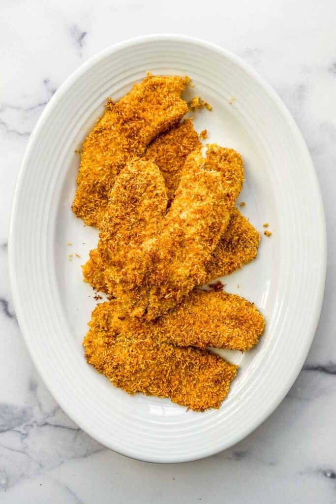 coconut crusted tilapia on a serving plate