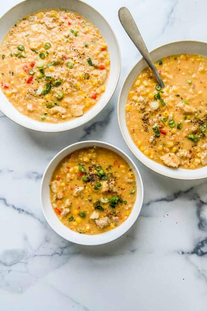 three bowls of chicken corn chowder