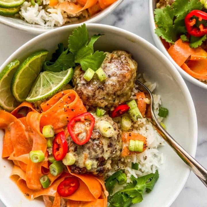 Healthy ground beef meatballs with Thai green curry in a bowl.