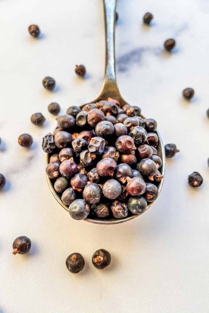 juniper berries in a large spoon