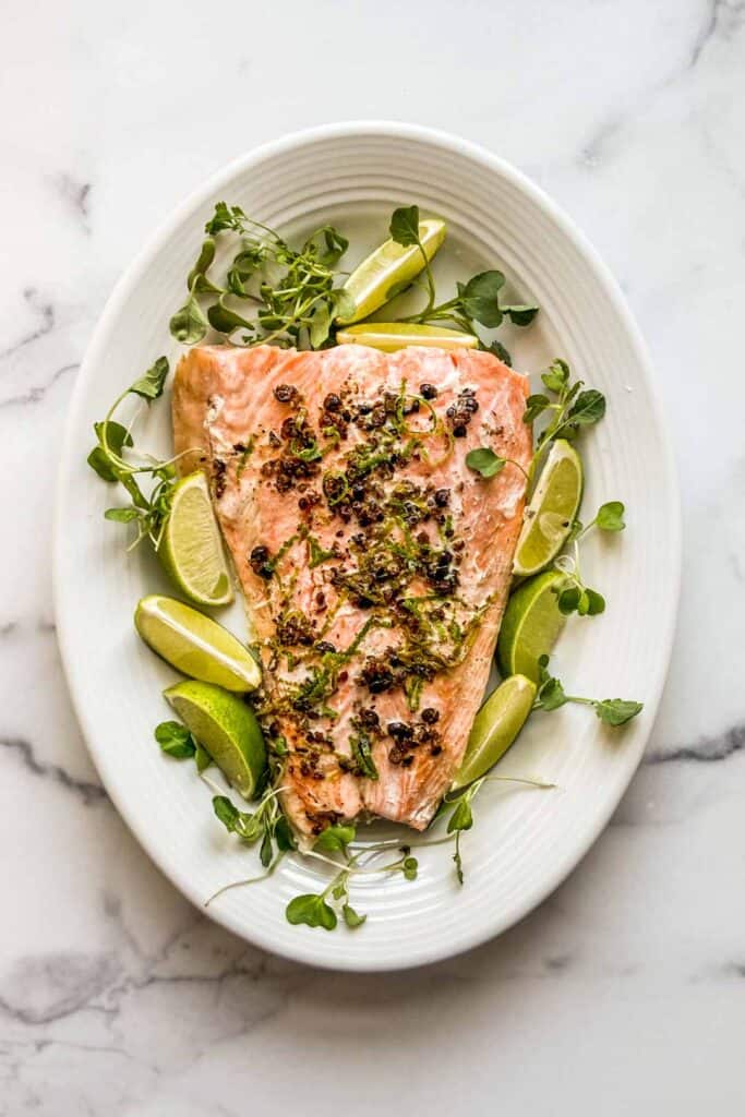 salmon with juniper berries and lime on a large serving plate