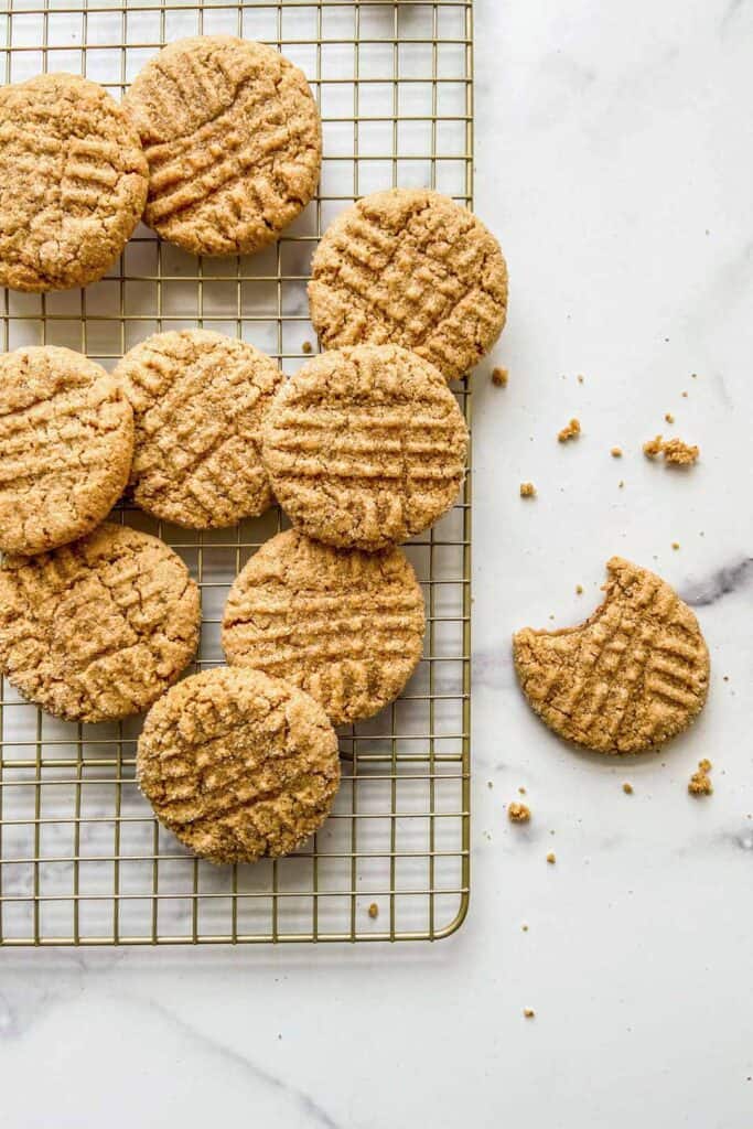 Vegan peanut butter cookies on a cooling rack.