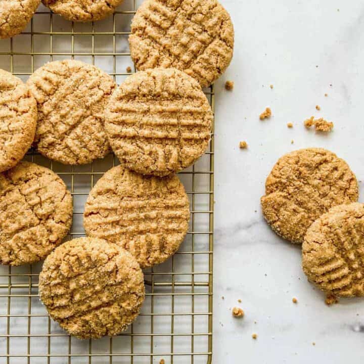 Peanut butter cookies on a cooling rack.