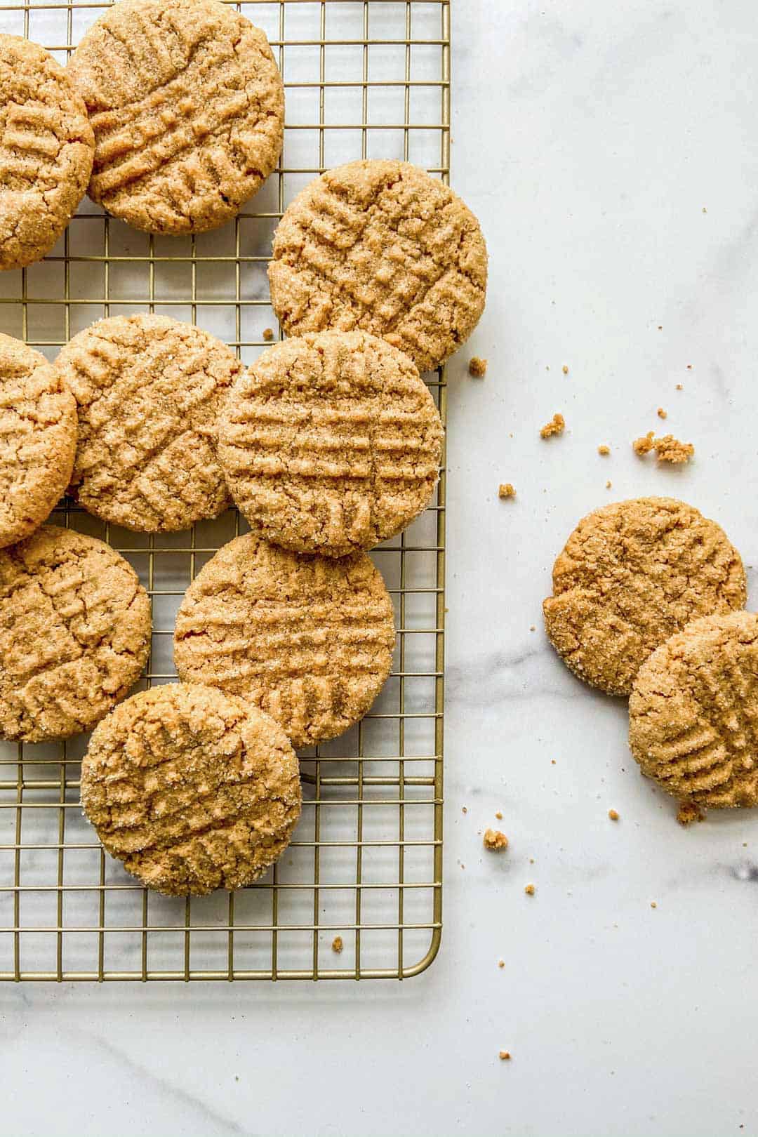 Peanut butter cookies on a cooling rack.