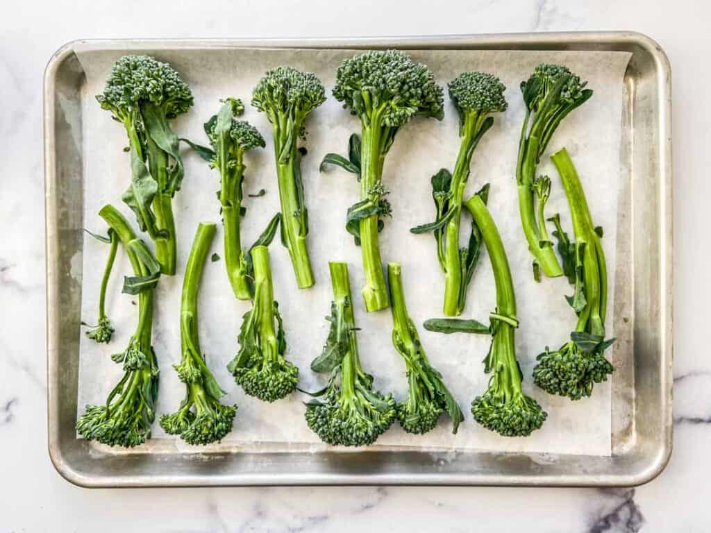 broccolini on a baking sheet
