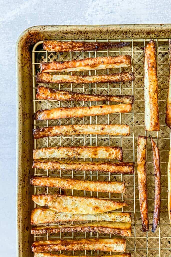 Baked fries on a baking sheet.