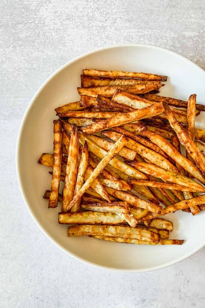 Togarashi fries in a white serving bowl.