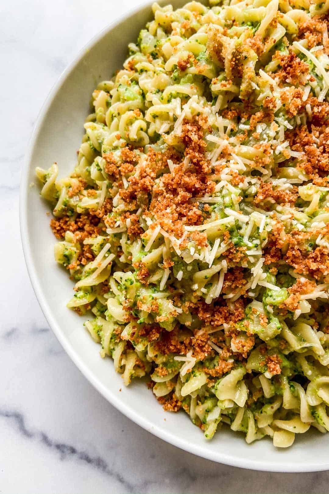 Broccoli pasta topped with panko breadcrumbs.
