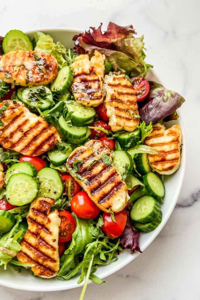 Close up shot of a grilled halloumi salad.