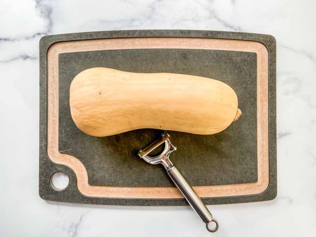 Butternut squash on a cutting board.