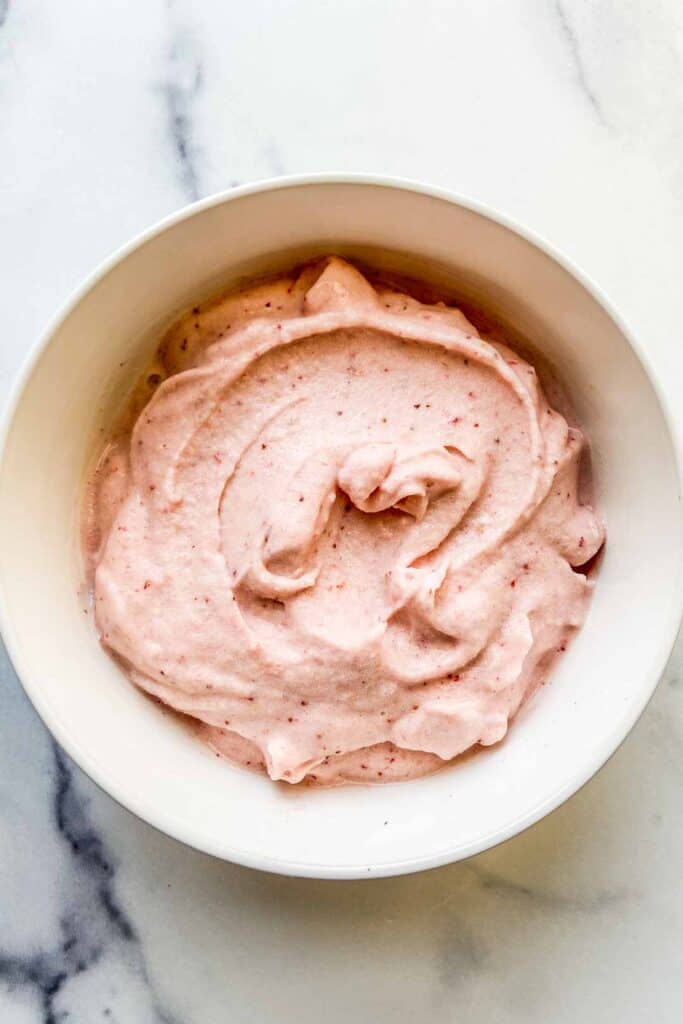 An overhead shot of a strawberry banana smoothie bowl.